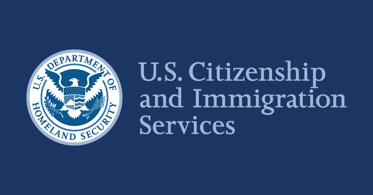 A USCIS sign, representing falling approval rates for extraordinary-ability and national-interest green card petitions.